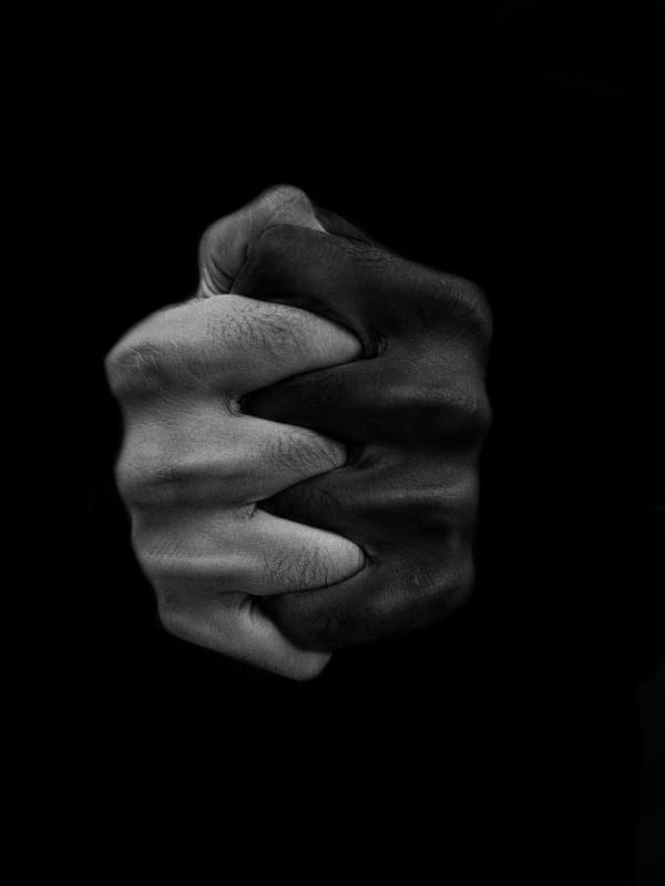 clasped hands of multiethnic people